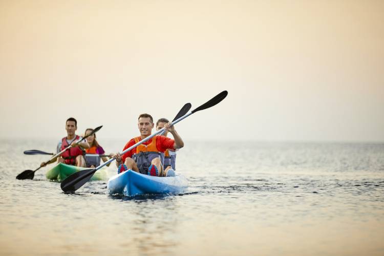 A family spends the day kayaking A family spends the day kayaking
