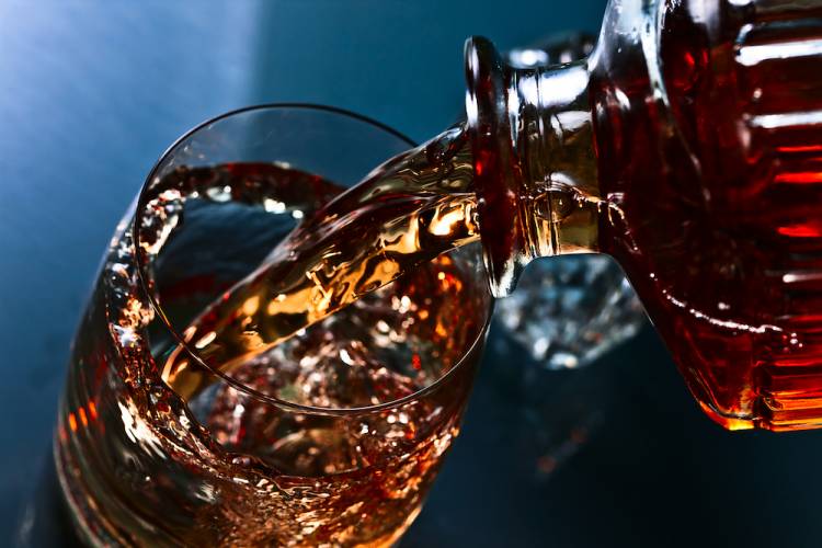 whiskey pouring into glass