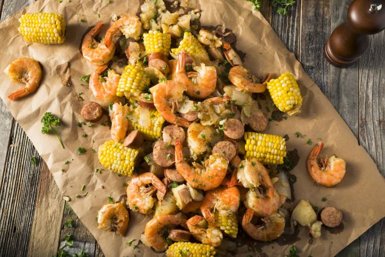 lowcountry boil spread on paper lined table
